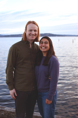 Jack Hood and Madeline Ferry standing together with a lake in the background